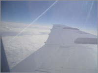 Над крылом самолета...